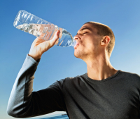 young man drinking water