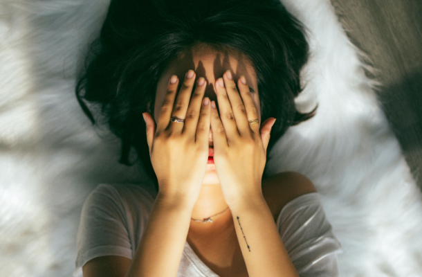 Girl sad hands on face