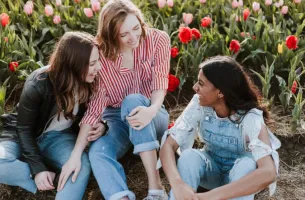 friends laughing garden flowers