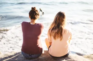 health girls sitting looking sea